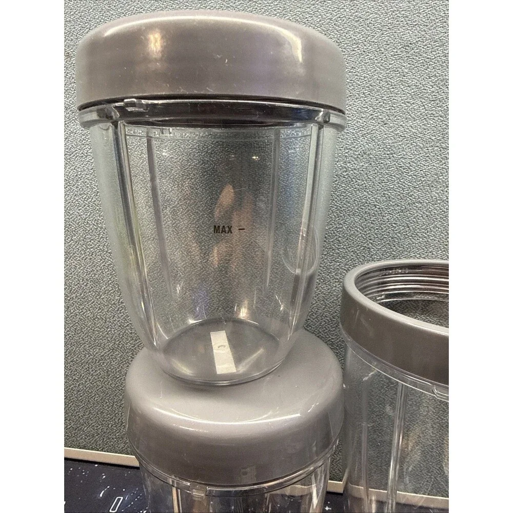 Nutribullet Lot Of 4 Replacement Cups With Lids